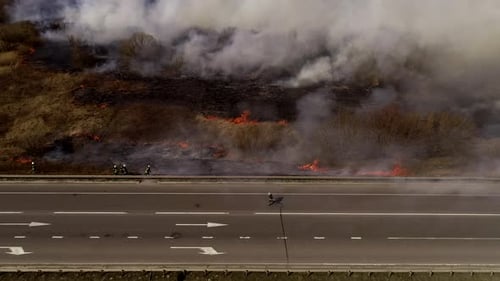 Grass Fire Burns Near Highway, Aerial View