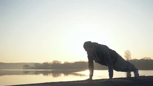 Training on the street against the rising sun.