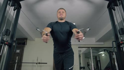 Bodybuilder Weightlifter Exercising at Gym