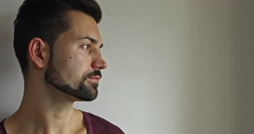 Bearded Man Drinking From Mug Indoors Close-Up
