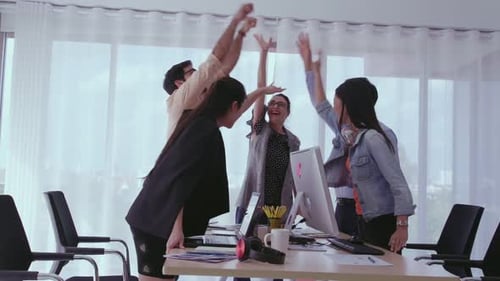 Successful Business People Celebrating Project Success at Office