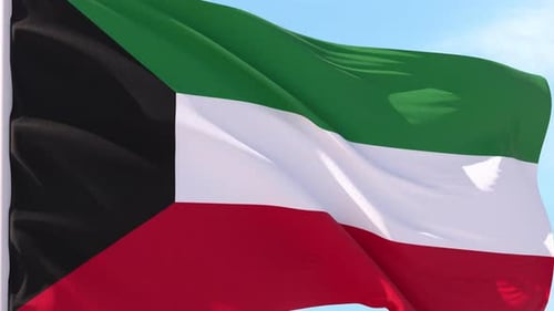 Kuwait Flag Waving in Slow Motion Against Blue Sky