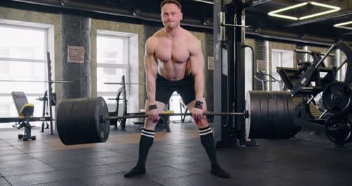 Athlete Lifts A Heavy Barbell, Powerlifting, Classic Style.