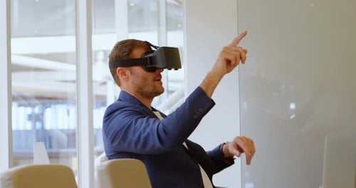 Man Using Virtual Reality Headset in Office