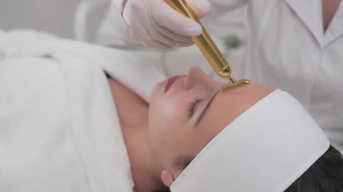 Side View of Girl Doing Facial Cosmetic Procedures in Clinic
