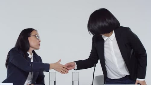 Businesswomen Discussing at a Corporate Conference