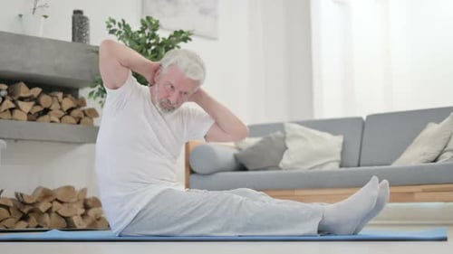 Senior Man Doing Crunches on Yoga Mat