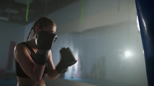 Woman Power Female Fighter Beats a Punching Bag Trains His Punches Training Day in the Boxing Gym