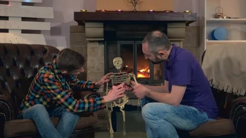 Dad Learning Son the Structure of Internal Organs of Human Body