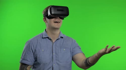 Man Using VR Headset Helmet To Play Game. Watching Virtual Reality 3d 360 Video. Chroma Key
