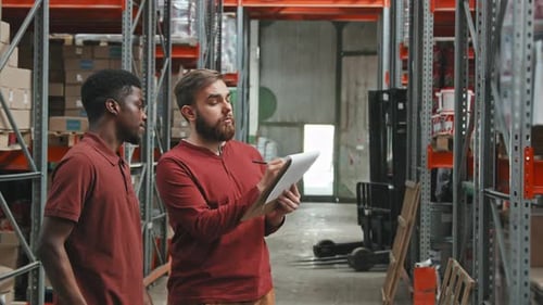 Portrait of Warehouse Workers Stocktaking