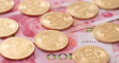 Bitcoin Coins and Chinese Yuan Currency Money