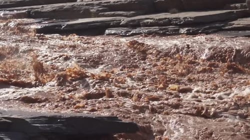 Follow Muddy Flooded River Splashing in Rapids after Heavy Rain Storm