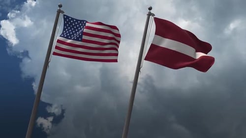 United States and Latvia Flags Waving on Cloudy Sky
