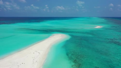 Aerial drone shot seascape of tranquil sea view beach trip by blue sea with white sandy background o