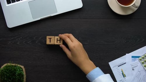 Spelling Therapy with Block Letters on Office Desk