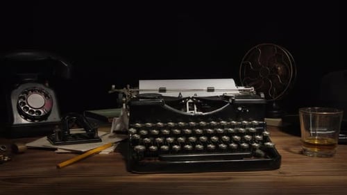Vintage Typewriter and Liquor on a Wooden Desk