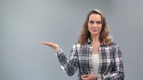 Woman Presenting and Gesturing to Blank Space
