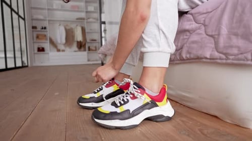 Unrecognizable Person Feet with Bright Sport Sneakers