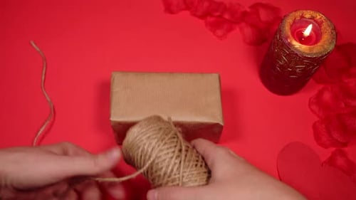 Hand Selecting Twine to Wrap Elegant Gift