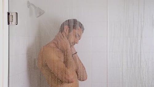 Man Washing in a Glass Shower