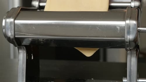 Making of Italian lasagna from dough 4K 2160p 30fps UltraHD footage - Close-up of manual pasta machi