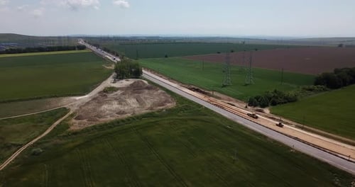 Road Construction Site with Machinery, Bulldozer, Excavation From Above. Video, Aerial View
