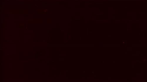 Red colour film noise or grain looped texture