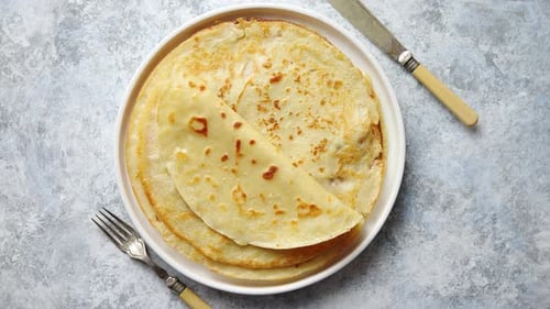 Delicious Golden Pancakes on Plate with Utensils