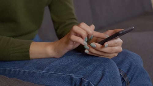 Close Up Shot of Young Woman Networking on Smartphone Watching Social Media News Slow Motion