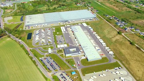 Aerial view of warehouse storages or industrial factory or logistics center from above. Top view of