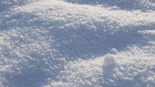 Fresh frozen crystalline water snowflakes over the hill slow tilt 4K 3840X2160 UHD video - White sno