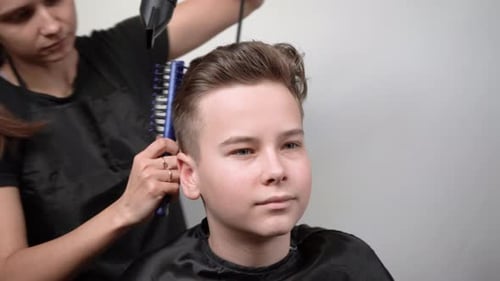 Teen Getting Modern Hairstyle