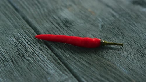 Vibrant Red Chili Pepper on Rustic Wood
