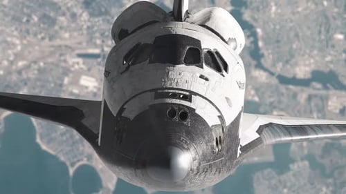 Transbordador espacial en órbita sobre la Tierra