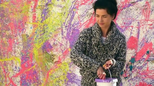 Woman Paints Colorful Abstract Mural on City Wall
