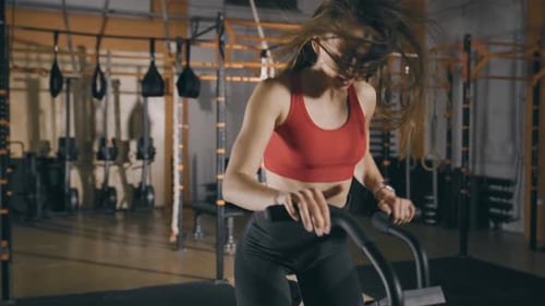 Woman Training on Exercise Bike