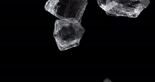 Ice Cubes Falling and Rotating on Black Background