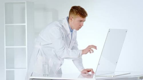 Caucasian Doctor Working on Invisible Interactive Screen