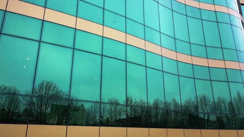 Futuristic design of skyscraper with glass mirrow windows outdoors.