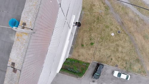 Industrial Alpinism. Aerial View. Work on Outer Insulate Building with Styrofoam