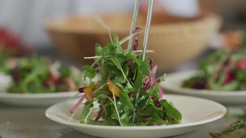 Salad is placed on plate