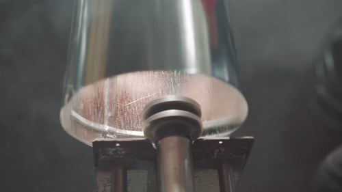 Close Up of the Hands of a Locksmith Working with a Machine on Metal. A Locksmith Who Works with a