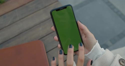 Crop View of Female Person Hand Pressing at Mock Up Phone Screen. Unknown Woman Using and Holding