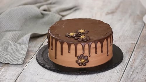 Decorating a Sweet Chocolate Cake with Flowers