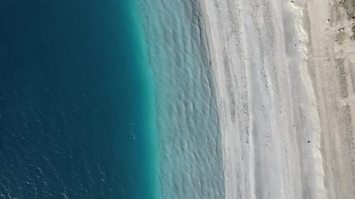 Aerial View of Turquoise Ocean Meeting White Sandy Beach