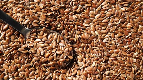 Brown Raw Flaxseeds as Background