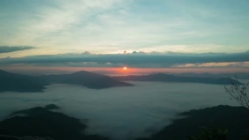 Majestic Sunrise Over Mountain Range With Fog