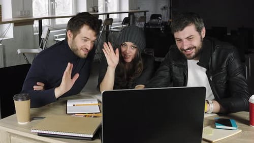 Team of Young Professionals Having a Conference Call in a Creative Office