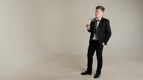 Stylish Blond Smokes A Cigarette.